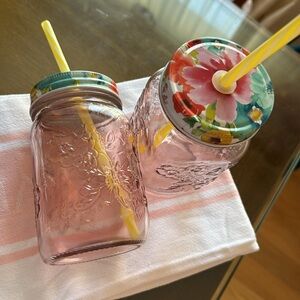 Pioneer woman set of two pink Mason jugs with floral top and yellow straw